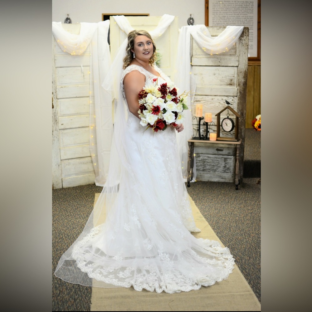 Size 16 wedding dress. Has a lace up back so it  can be somewhat adjusted